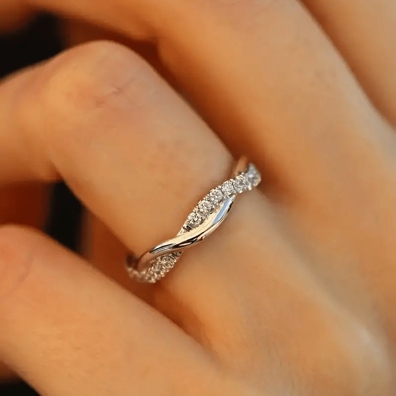 White plated twisted band ring with pave setting